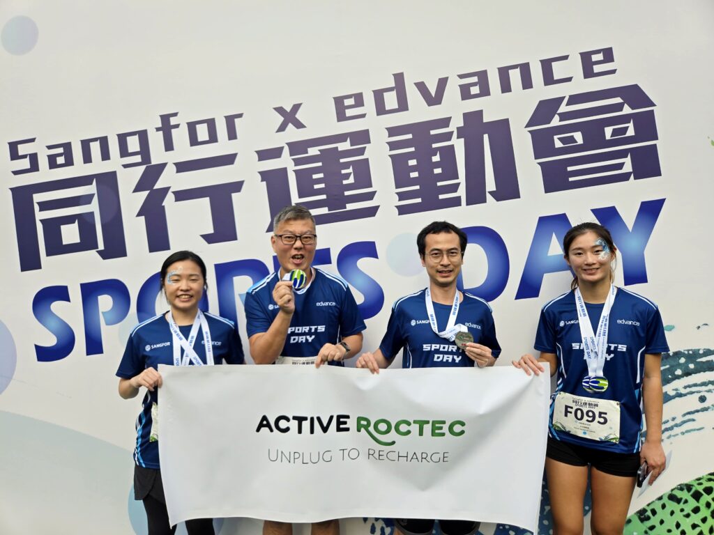 Roctec colleagues hold their medals.