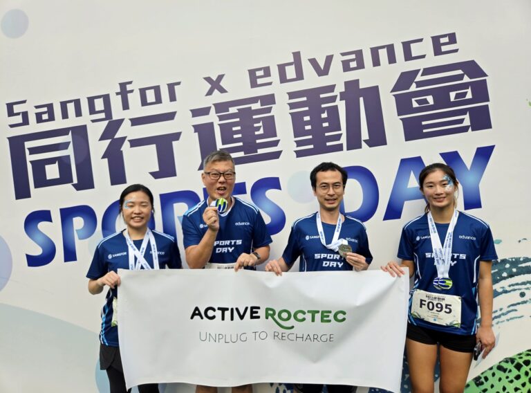 Roctec colleagues hold their medals.