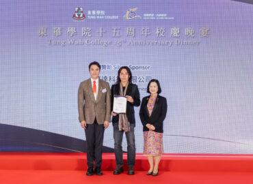 Our COO is receiving a Certificate of appreciation on stage from Tung Wah College.